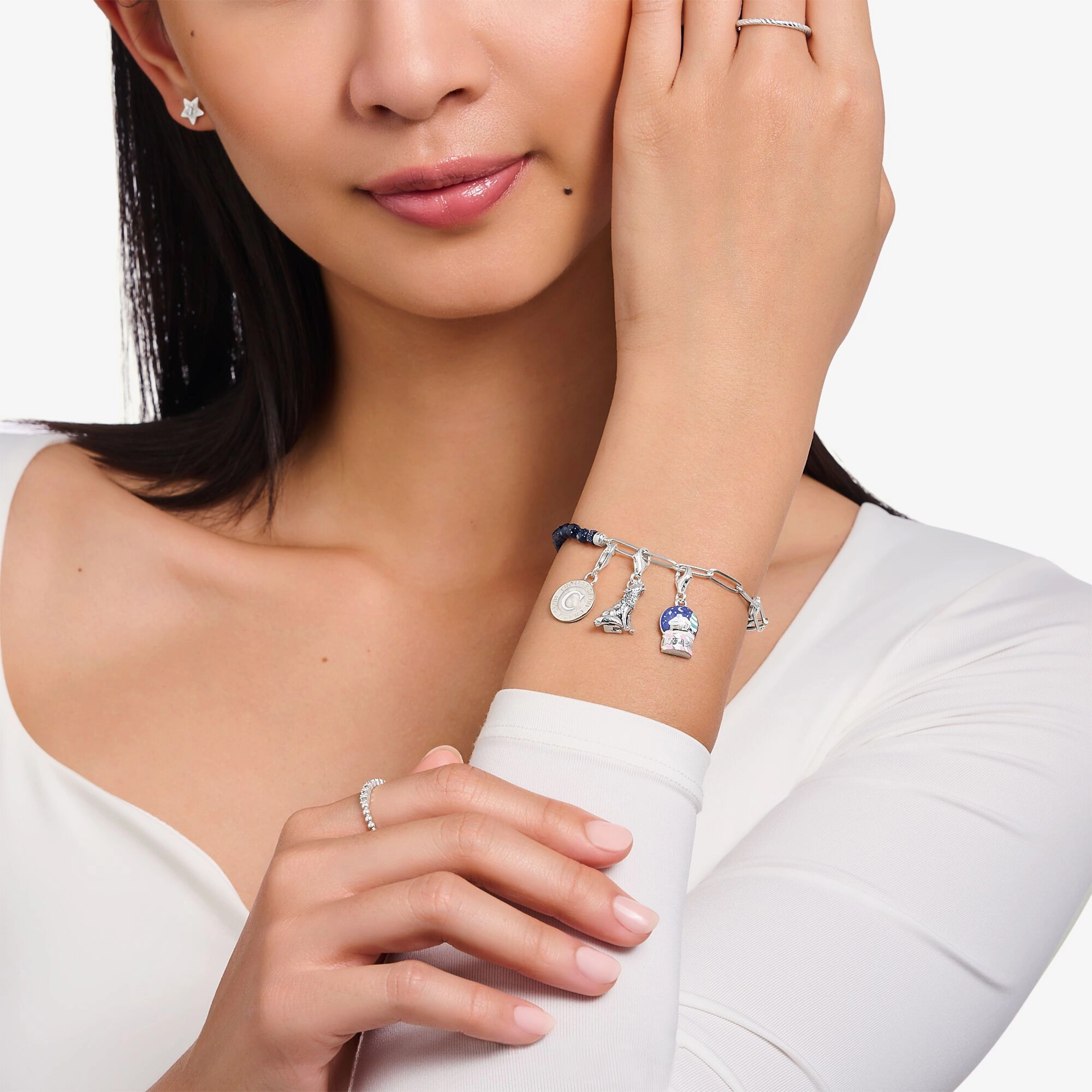 Silver wolf charm with moon and star